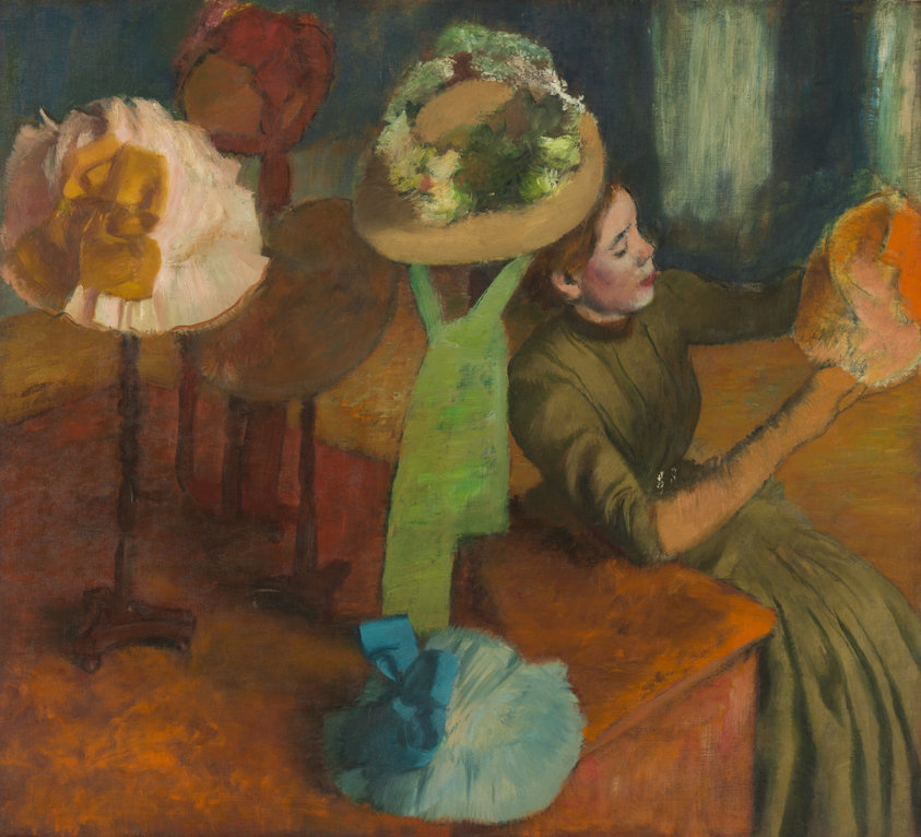 When this work was painted, millinery work (hat making) was considered a prestigious trade, elevating the women who succeeded in the business. Degas addressed this subtle shift in the class hierarchy: He gave his milliner a dress nice enough to be worn by an affluent woman, and though she does not wear the expected hat of a high-class lady, Degas playfully positioned the hat with green trimmings so it seems to sit atop the woman’s head.