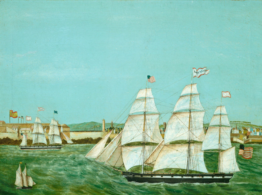 This painting shows a maritime scene from the water, with a coastline in the distance marked by small, colorful buildings and distant green hills. Closer to us, a large ship with white sails floats on the green waves, flying the American flag and a flag that appears to have the word "Arkansas." Miniscule figures are visible on the deck of the ship, and thin ropes crisscross the three tall masts. On the left are two smaller ships. The one in the back flies a flag that says "Russia," while the closer ship near the bottom left corner has a design on the back that appears to say "Cuba." The sky above is bright blue, uninterrupted by clouds.