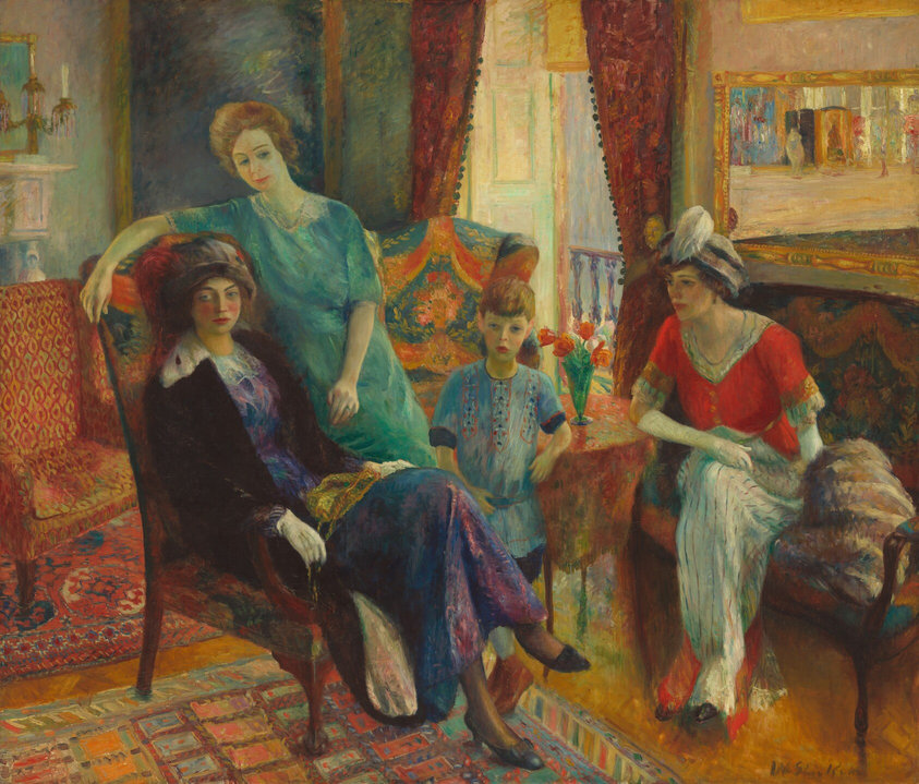 This painting shows four individuals - three women and one child - in an indoor setting. One woman is seated on a chair on the left, wearing a purple and blue dress under a black coat, with white gloves and a gray hat. Next to her, sitting on an arm of the chair, is another woman with blonde hair, wearing a light teal dress. To the right, in the center of the painting, a child stands, wearing a blue dress or tunic. On the far right, a third woman sits on a bench, wearing a bright red-and-white dress with a white-and-blue hat capped with a white feather, as well as long white gloves. All of the people have pale skin, and their faces are detailed. The room around them has other colorful furniture, including two armchairs in shades of red and teal, and the walls are in shades of light blue and cream. Red curtains hang over an open window or balcony, and there's a painting in a gold frame on a wall on the right. The orange floor beneath them is covered in several colorful, patterned rugs.