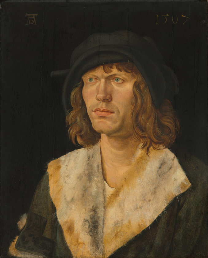 This painting is a portrait of a man from the chest upwards, his body and head turned slightly to the left. The man has pale skin, blue eyes, high cheekbones, slightly furrowed brows, a straight nose, and pink lips in a neutral expression. He has shoulder-length wavy brown hair and wears a dark green jacket with a white-and-yellow fur collar and a floppy black hat with a brim that curves around his forehead. The background is plain black. A monogram is visible in the top left corner, and the date "1507" is inscribed in the top right corner.