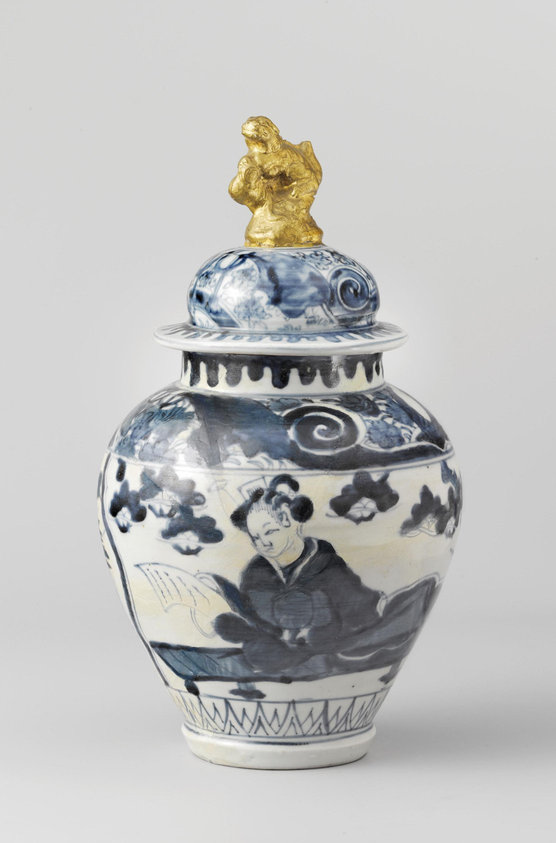 Ovoid covered jar with a woman reading a letter and finial in the shape of a shishi