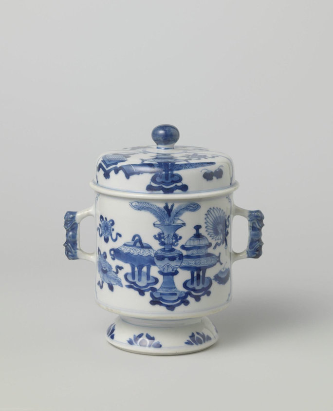 Cylindrical covered jar on foot with precious objects and antiquities